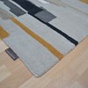 Purple and beige rug